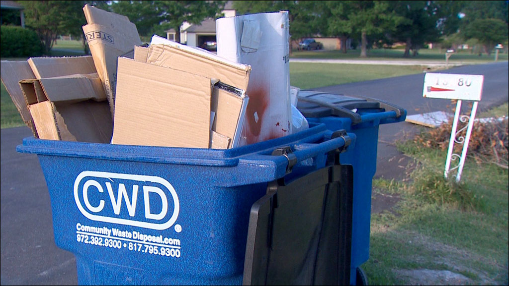 Recycling carts waiting for pickup in Frisco