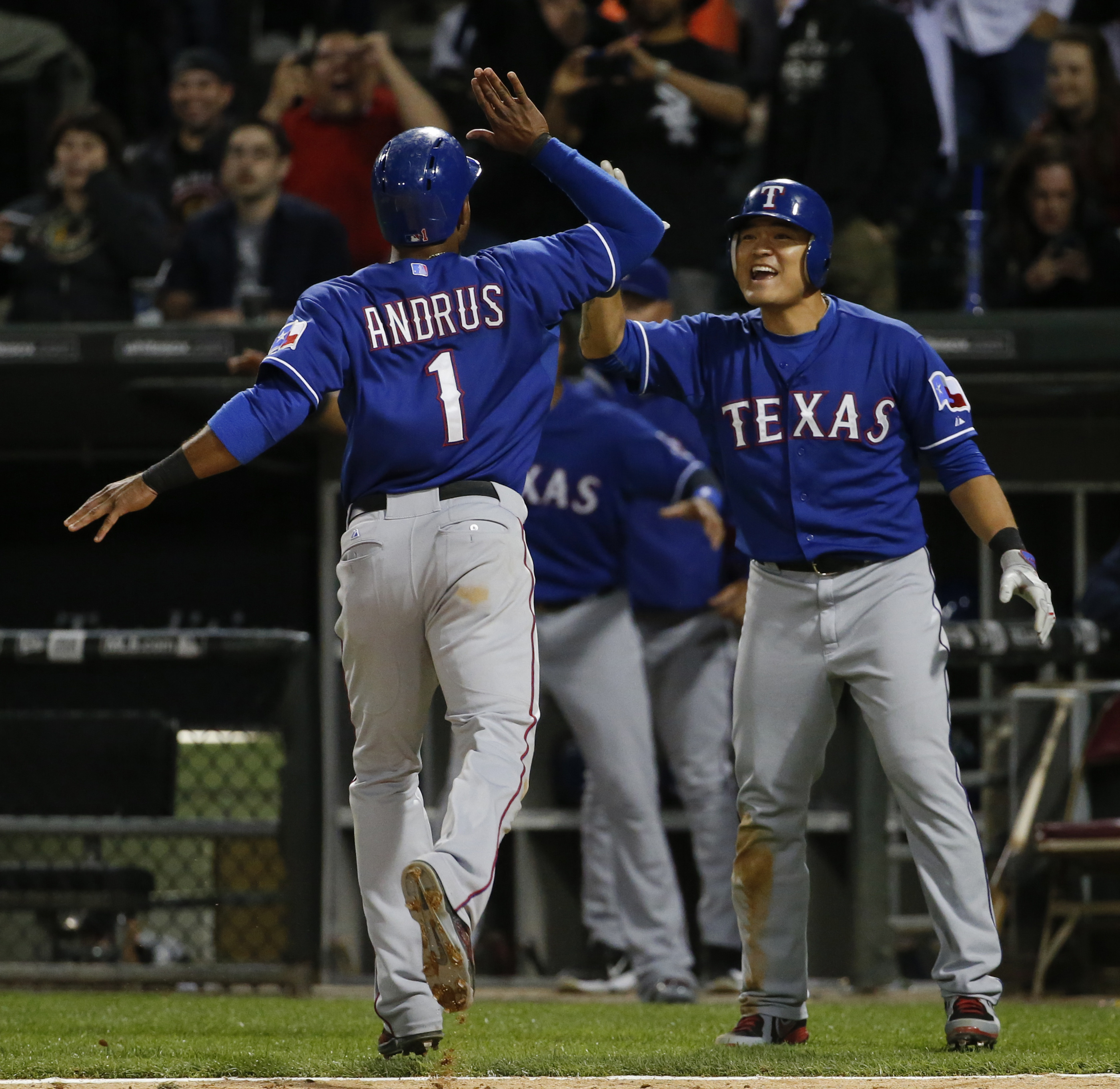 Texas Rangers shortstop Elvis Andrus, left, gets a word from Texas