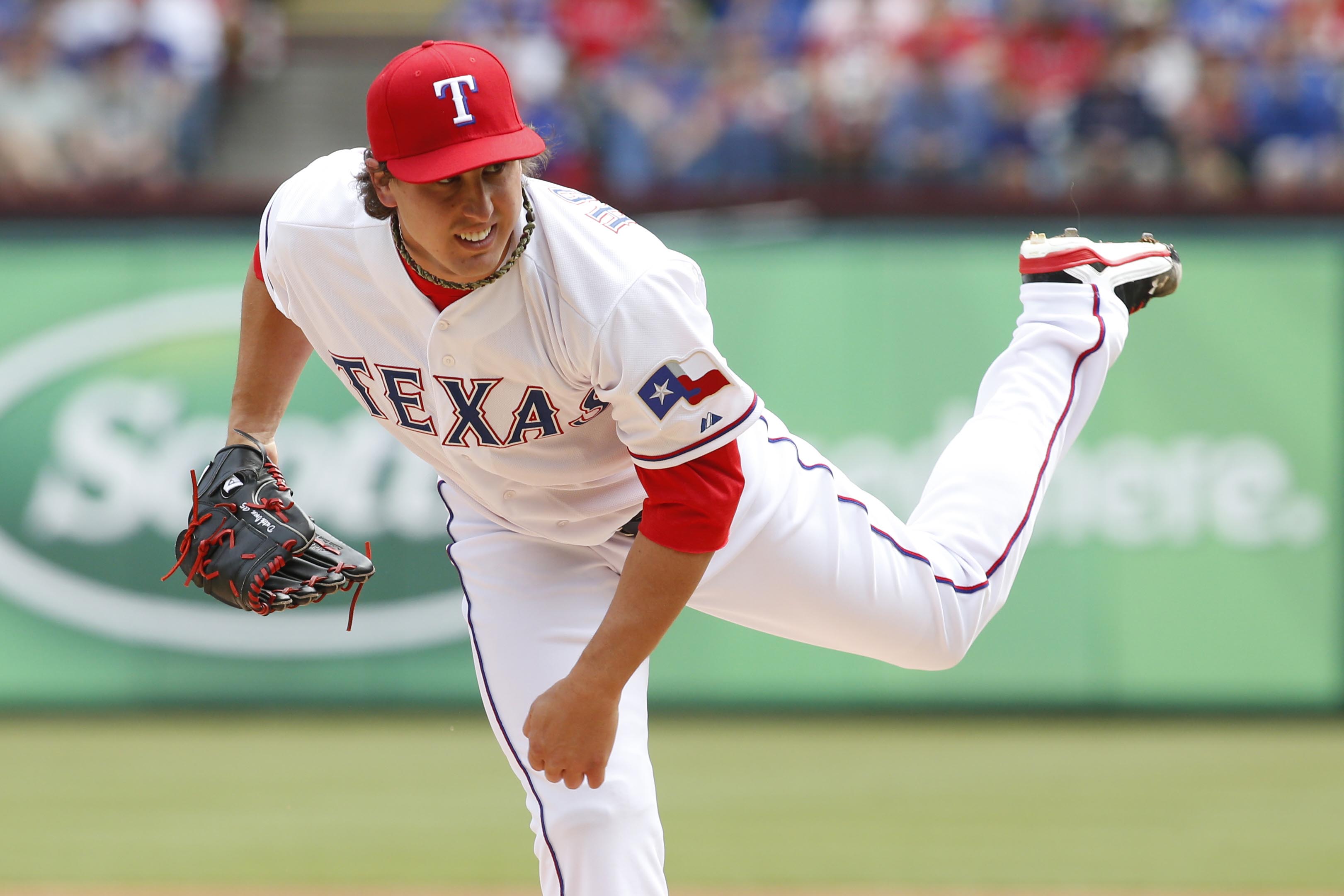 Texas Rangers starting pitcher Derek Holland works against the