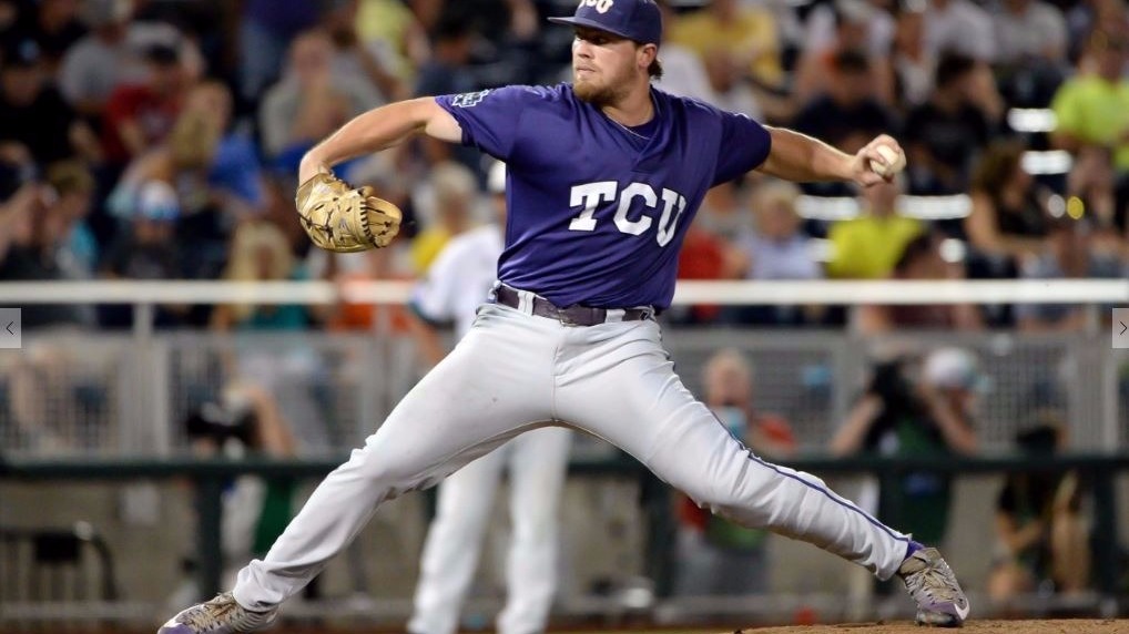 Vanderbilt Commodores starting pitcher Walker Buehler (13) delivers a pitch  to the plate against the TCU Horned Frogs in Game 12 of the NCAA College  World Series on June 19, 2015 at