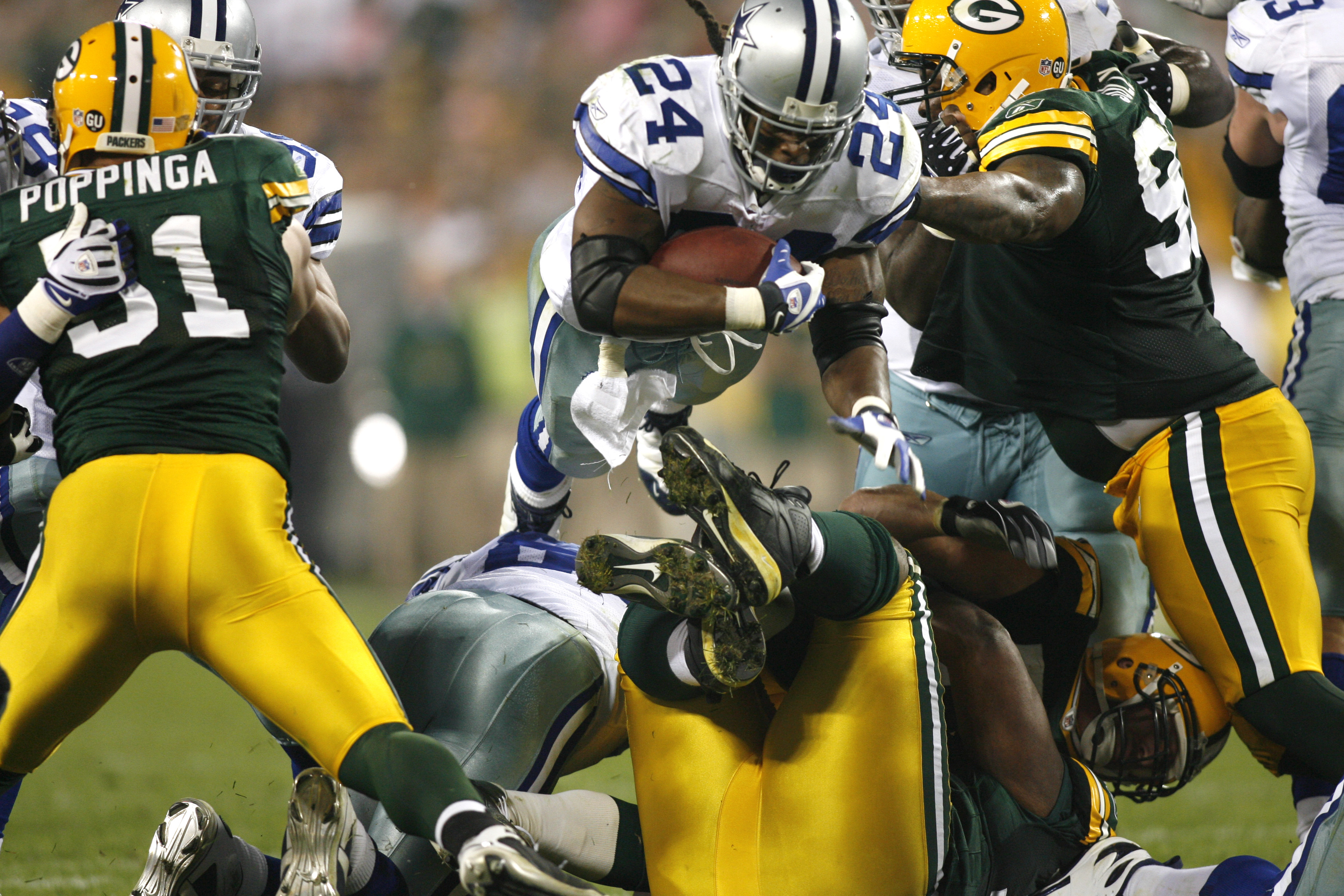 Miles Austin of the Dallas Cowboys breaks a tackle and continues to News  Photo - Getty Images