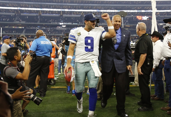 Dallas Cowboys quarterback Tony Romo (9) runs out of the pocket